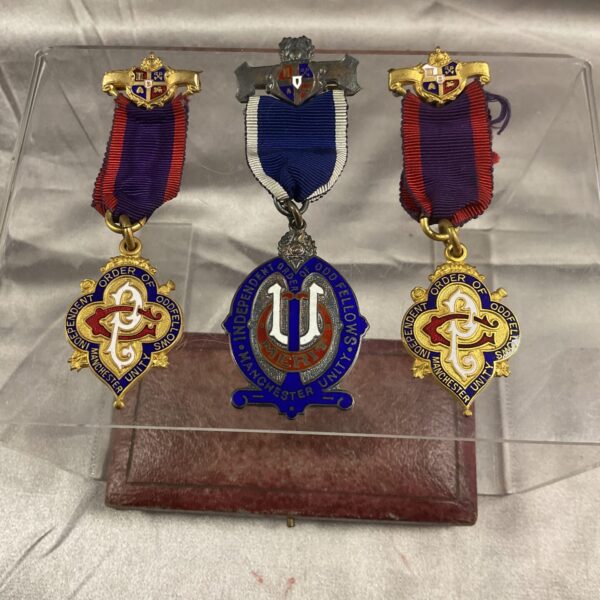 Vintage Odd Fellows Masonic jewels lot displayed front view.