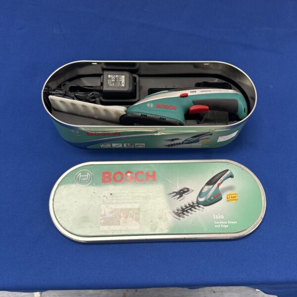 Bosch ISIO cordless trimmer in open case with charger.