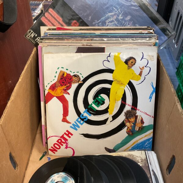 Vinyl record lot featuring North West Ten and Toto albums.
