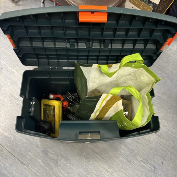 Open Zag plastic toolbox filled with tools and hardware.