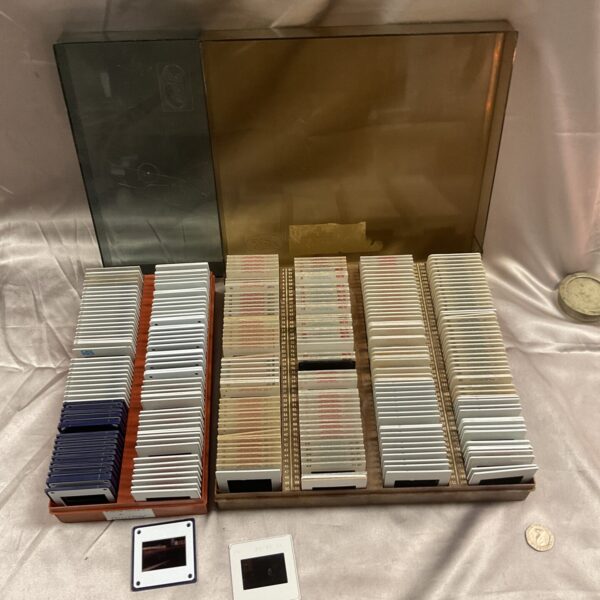 Metal case holding a large collection of vintage 35mm slides.