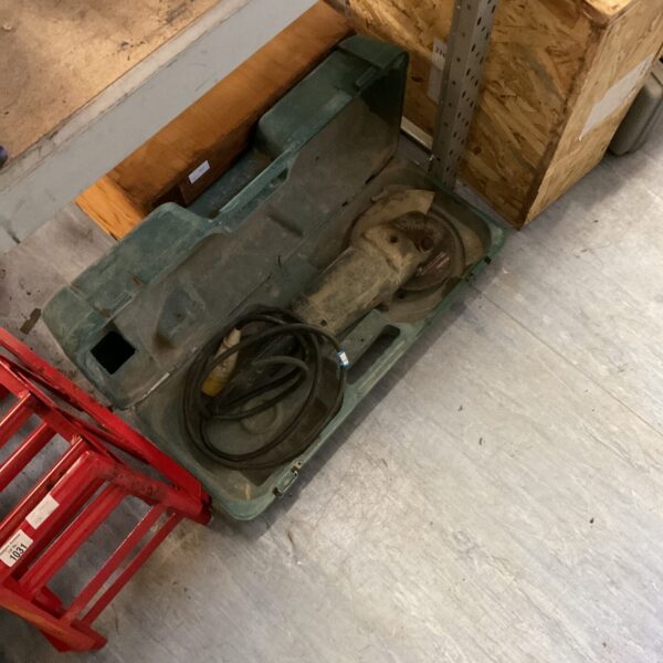 Bosch disc cutter in its original carrying case, showing signs of use.