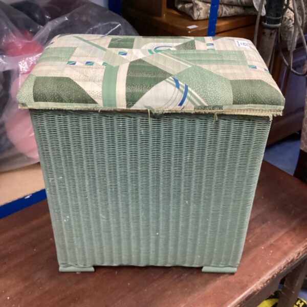 Vintage Lloyd Loom wash basket with pale green pattern.