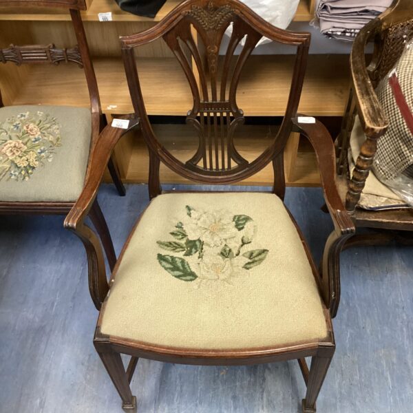 Antique wheatsheath backed carver chair with upholstered seat.