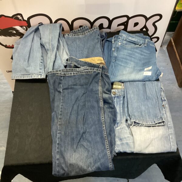 Stack of five pairs of vintage Levi's jeans.