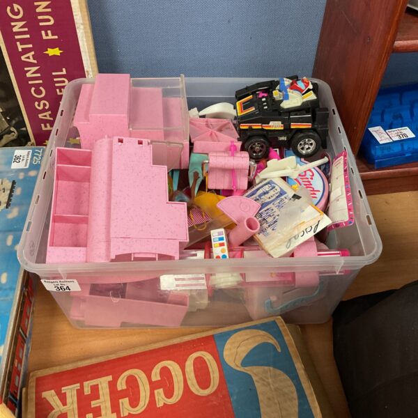 Mixed toy lot featuring a vintage Transformer action figure.