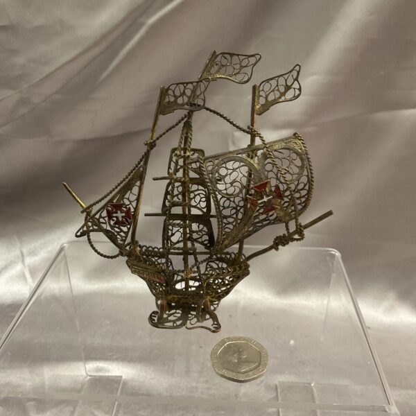 Intricate brass wirework Portuguese galleon model, nautical decor.