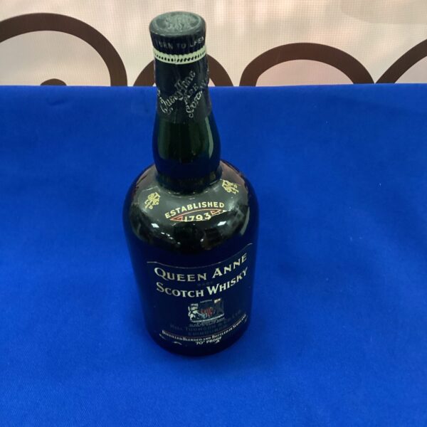 Vintage Queen Anne Scotch Whisky bottle, collectible antique spirit.
