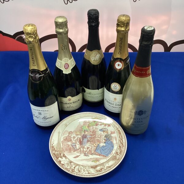 Vintage wall plate featuring champagne bottles, including Mountbridge and Graham Beck.