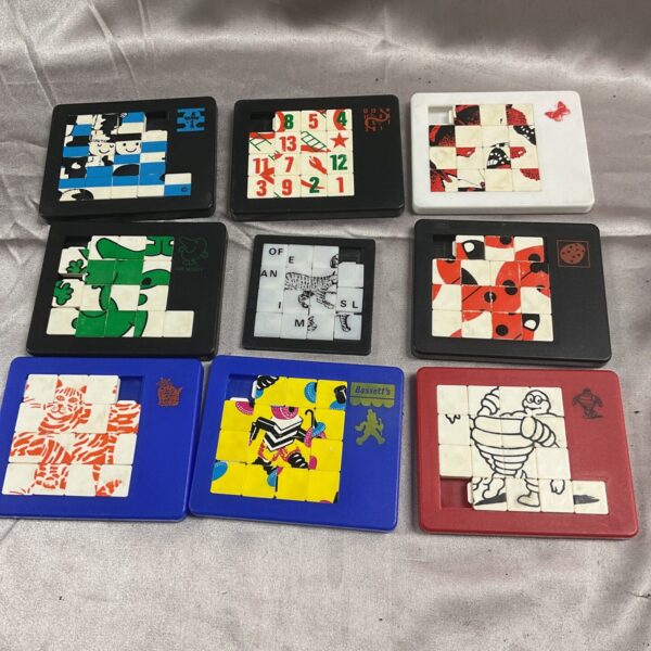 Vintage puzzle games lot with dodo designs, collectible retro toys.
