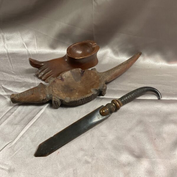 Three African hand carved wood items two ash trays and paperknife