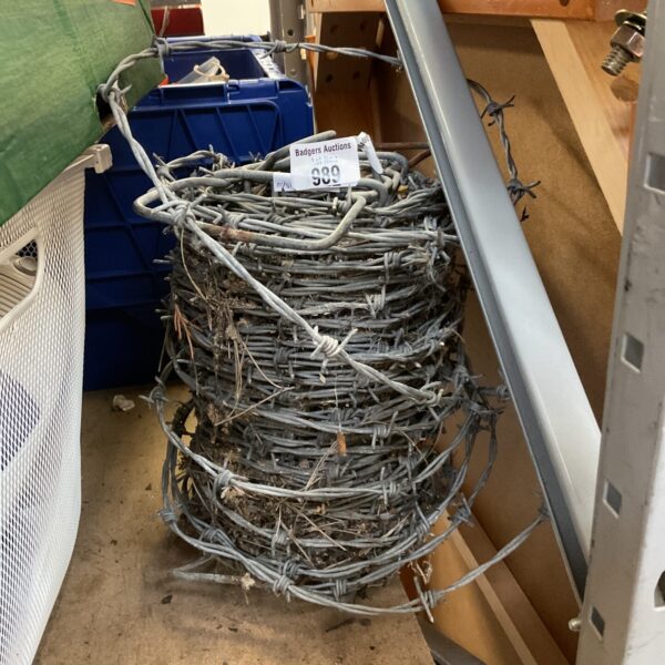 Galvanized steel barbwire roll for fencing and security.