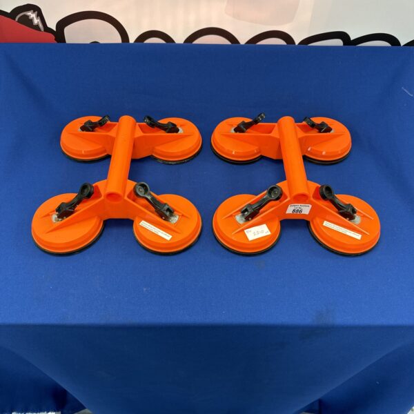 Two glass suction cups for lifting and handling glass.