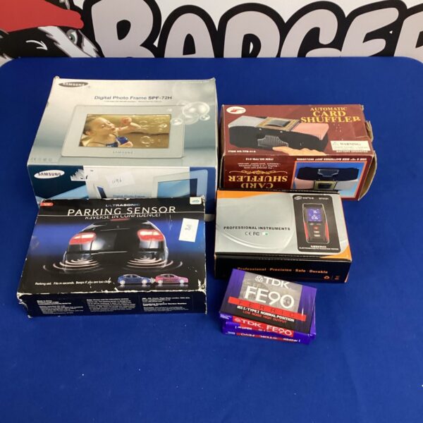 Automatic card shuffler in its original box, vintage casino equipment.