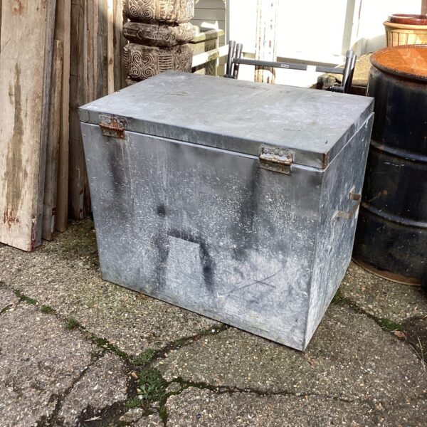 Weathered vintage galvanised storage box with a locking mechanism.