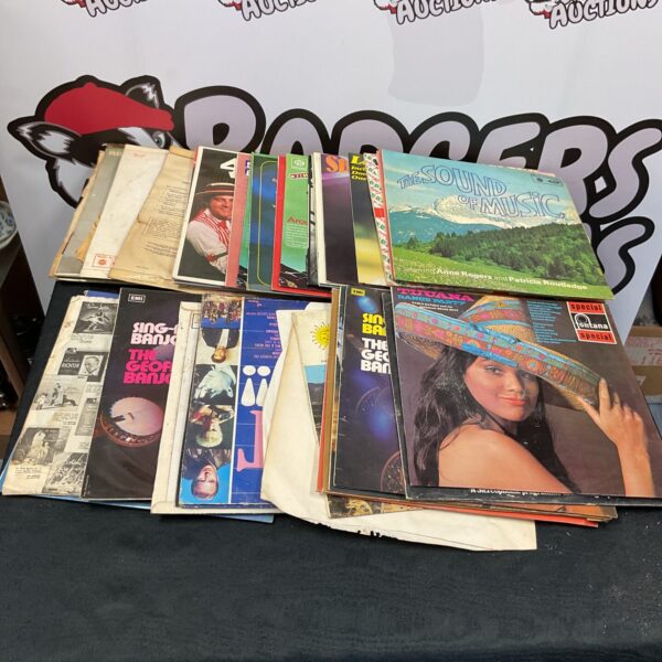 Vintage vinyl record collection including The Sound of Music album.
