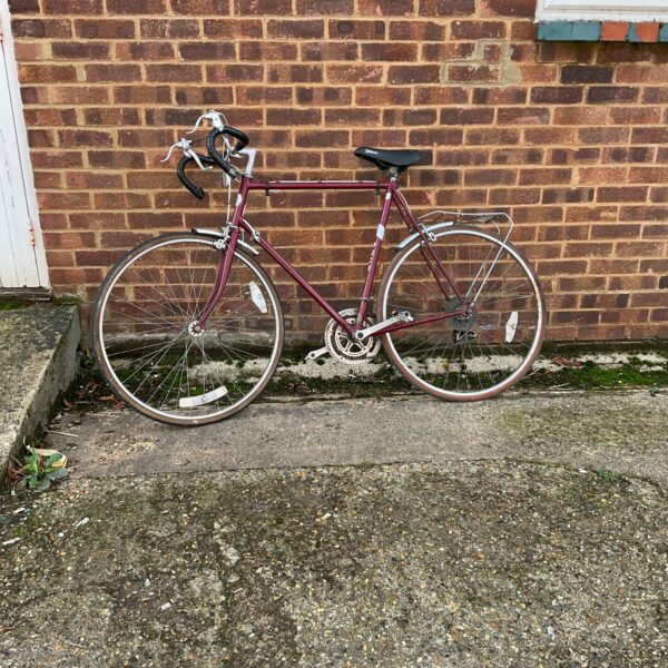 Vintage Puch racing bike with steel frame and drop handlebars.