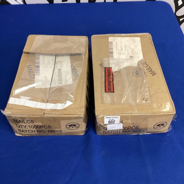 Two boxes of unused sealable plastic bags for mailing and packaging.