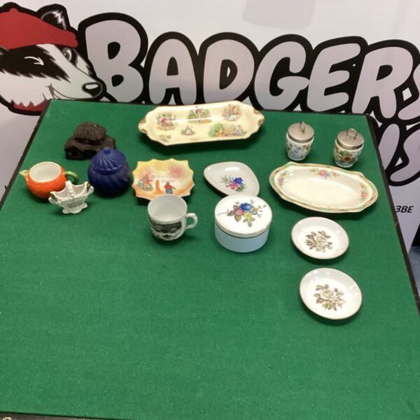 Mixed china collection with Royal Worcester pieces on display.