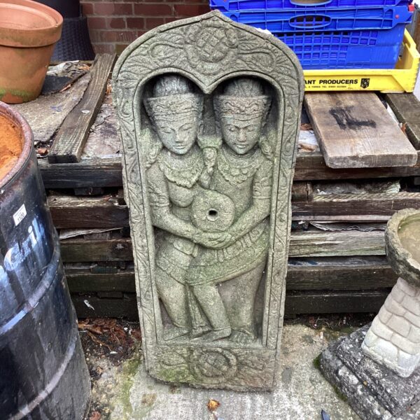 Detailed stone wall plaque designed as a garden water feature.