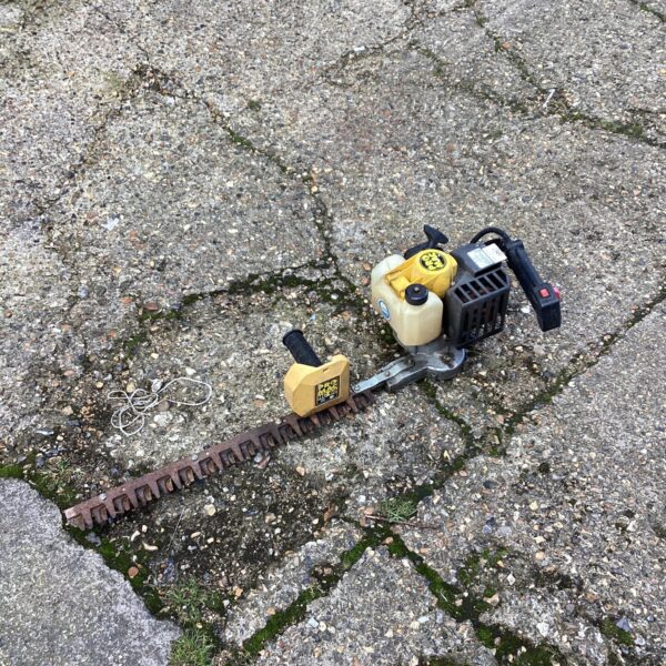 Pro Mac petrol hedge trimmer for garden landscaping and maintenance.