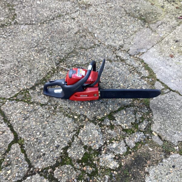 Used Mountfield petrol chainsaw for garden maintenance and landscaping.