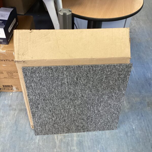 Box of carpet floor tiles for home improvement and flooring projects.