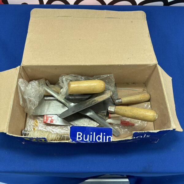 Vintage builders trowels lot with wooden handles.
