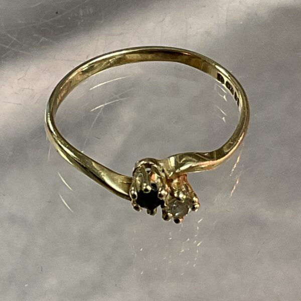 Close-up of 9ct gold sapphire and diamond ring.