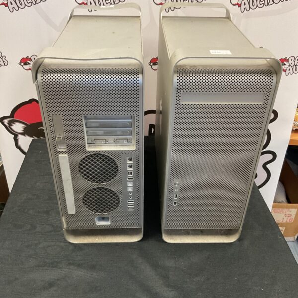 Two silver PC tower units, iMac style, offered as untested.