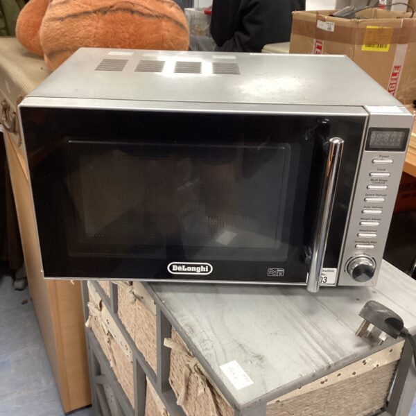 Stainless steel DeLonghi microwave oven on a countertop.