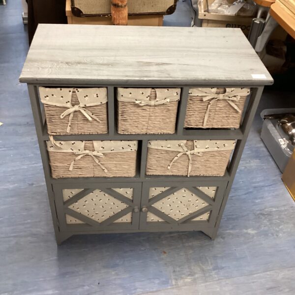 Shabby chic storage unit with woven wicker baskets for rustic decor.
