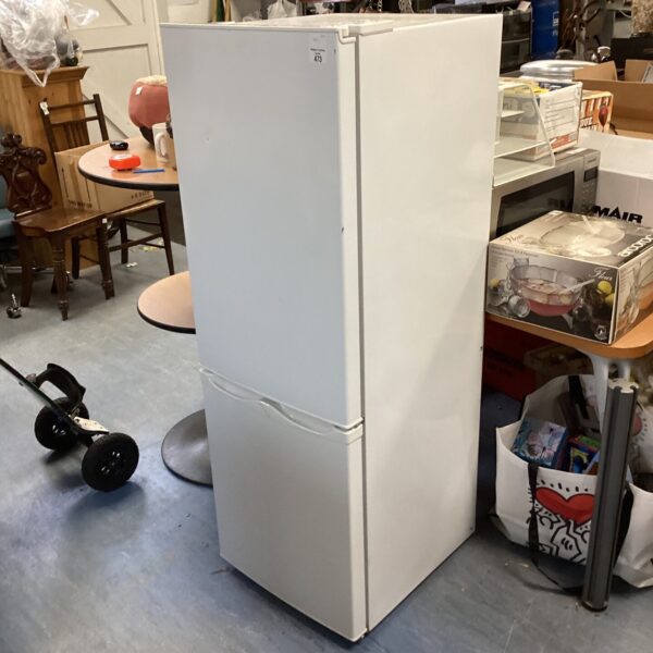 White compact fridge freezer in a cluttered auction environment.
