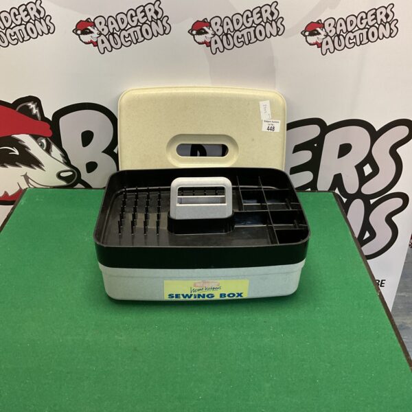 Grey plastic Curver sewing box with internal dividers.