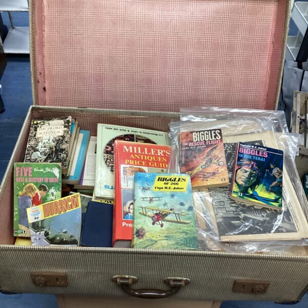 Vintage book lot featuring Biggles adventures and other titles.