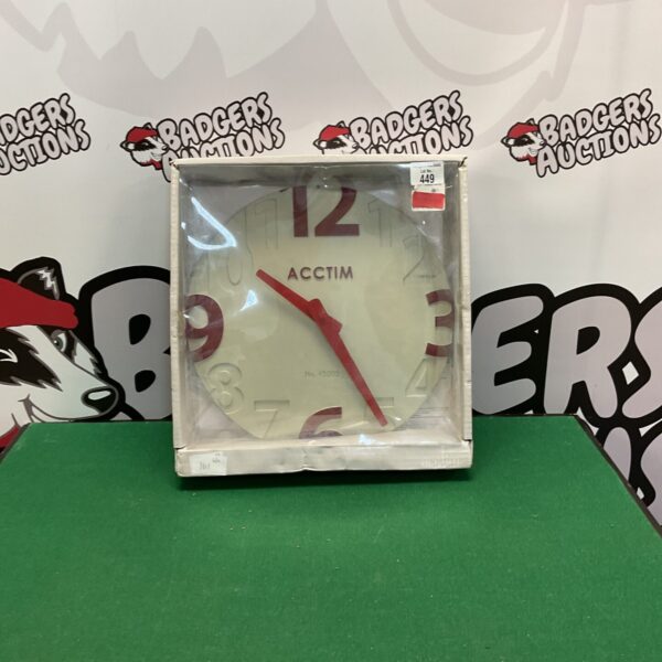 Vintage ACCTIM digital clock with red LED display.