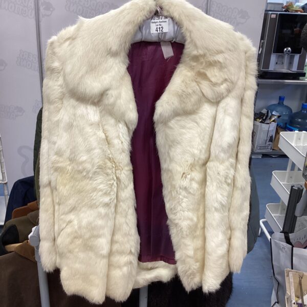 Creamy white vintage Artic Fox fur coat, luxurious winter fashion.