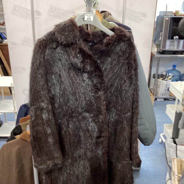 Luxurious antique black fur coat, a classic vintage fashion piece.