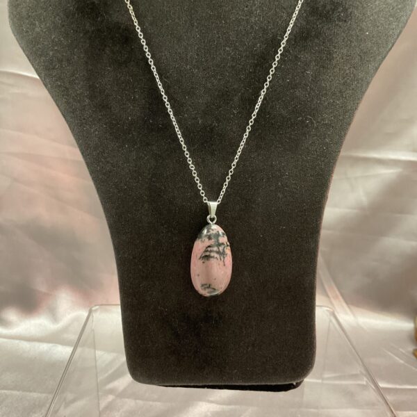 Close-up of rhodonite pendant necklace with 925 silver chain.