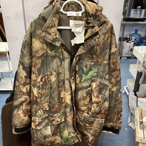 XL Sportchief camouflage hunting jacket for outdoor activities.
