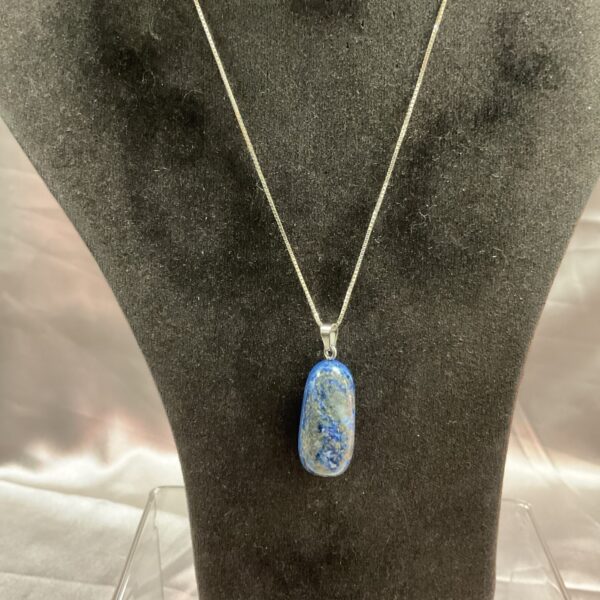 Elegant blue stone pendant necklace with silver chain.