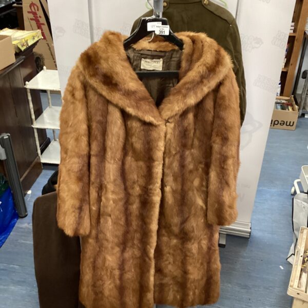 Elegant vintage James of Mayfair London fur coat, a classic fashion piece.