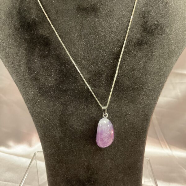 Elegant purple fluorite pendant necklace on a silver chain.
