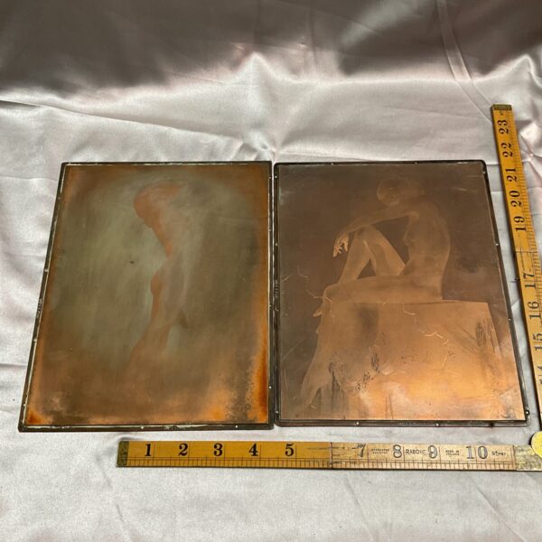 Antique copper printing plates with nude female figures, a collectible art piece.