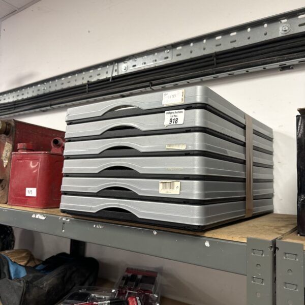 Stack of six grey folding storage crates for home or utility use.