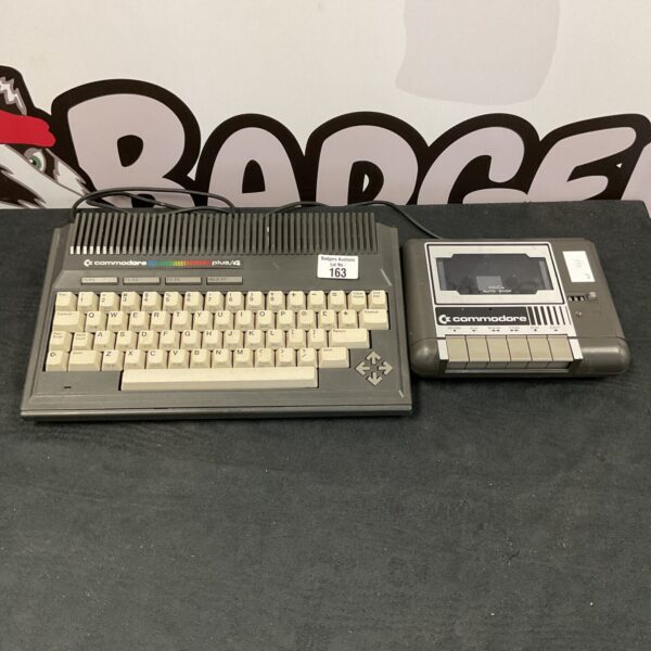 Vintage Commodore Plus 4 computer console with cassette deck.