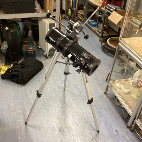 Skywatcher telescope on tripod for astronomy and celestial viewing.