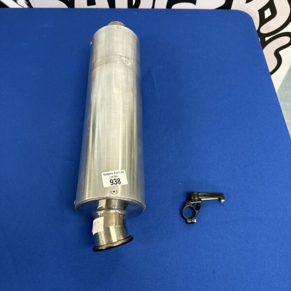 Used motorcycle rear exhaust silencer with mounting bracket.