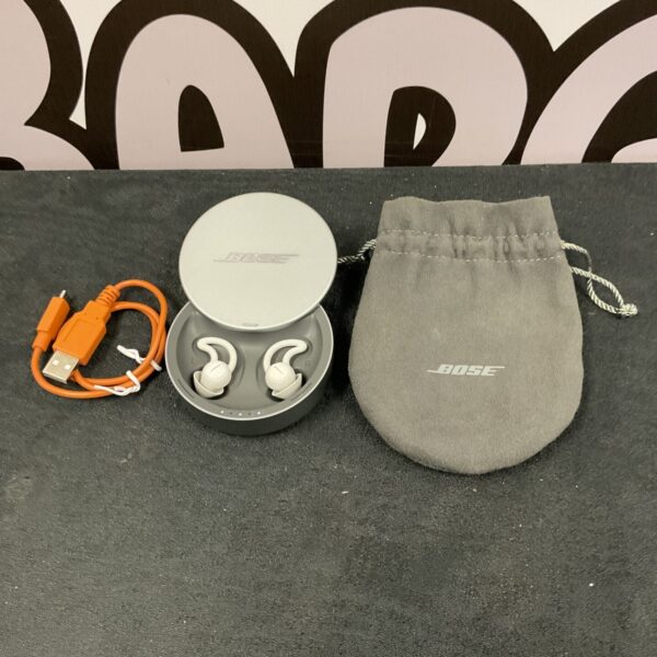 Bose Sleep Buds 2 wireless earbuds in charging case.