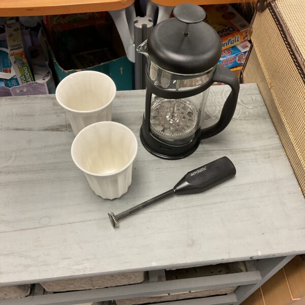Vintage coffee maker set with electric whisk and cups.